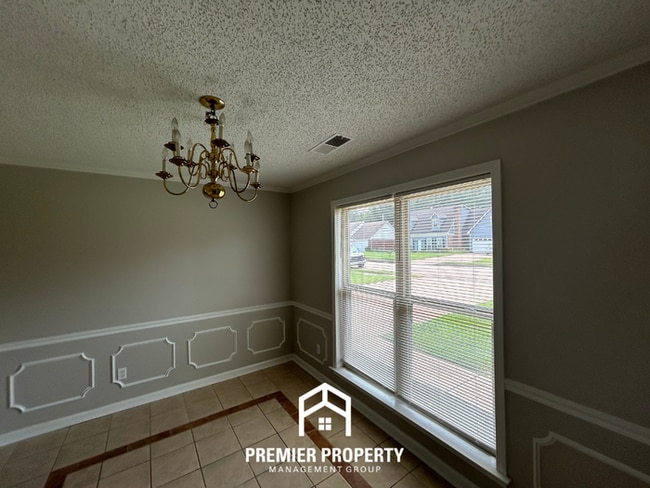 Photo - Spacious 4BR/2BA Near Southwind | High Ceilings, Brick Fireplace & 2-Car Garage