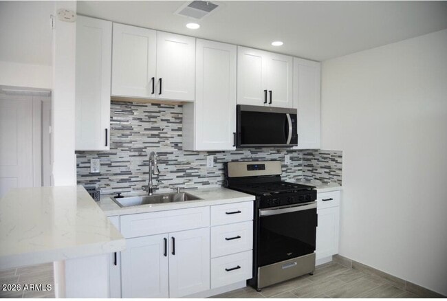 Building Photo - 11033 N 16th Ave Unit 3