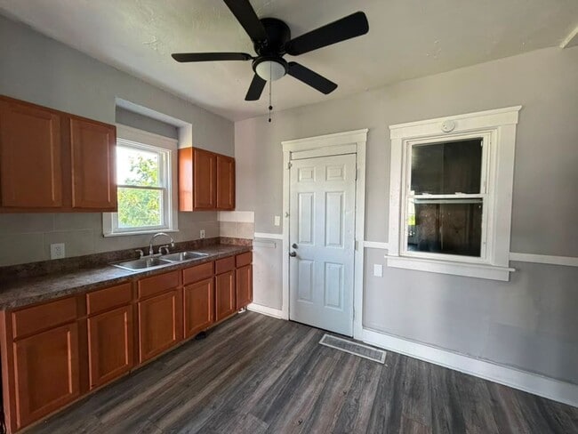 Photo - Four bedrooms. A sunroom. A fenced yard. A garage. Your next home is ready to be discovered!