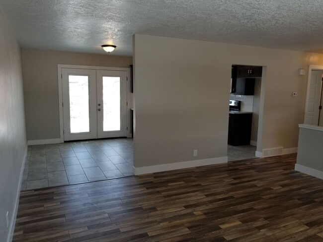 Photo - Spacious 5-Bedroom Magna Home with Deck and Ample Parking