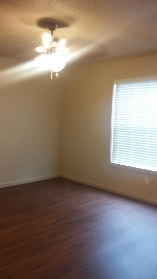 Wood Plank Flooring and 2" Faux Wood Blinds throughout