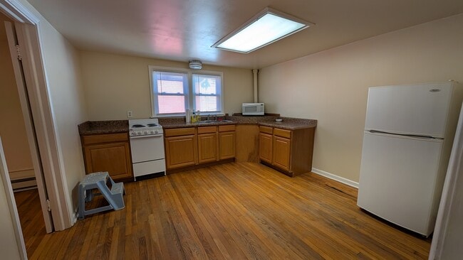 Spacious kitchen. - 20 W Main St Unit 200