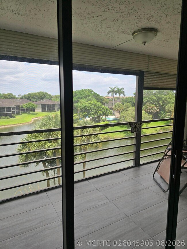 Building Photo - 7580 Regency Lake Dr Unit 402