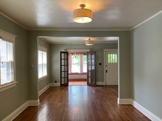 Bright, open living room and dining room with sun room - 1310 S Phillips Ave