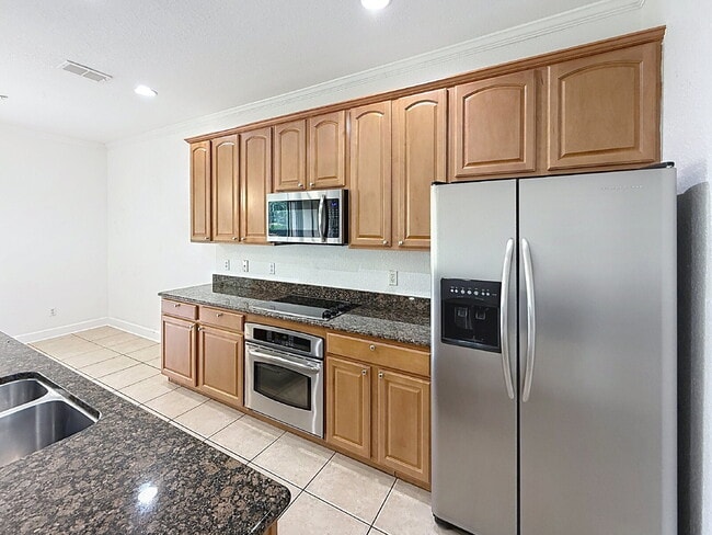 Photo - Beautiful 3 Beds and 2.5 Baths townhome with 2 car garage in Stonebridge Commons! Unidad 103