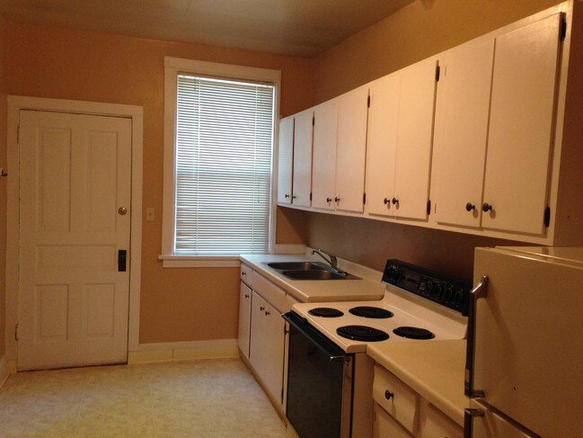 Kitchen is painted yellow - 1205 E 4th St Unit 1205