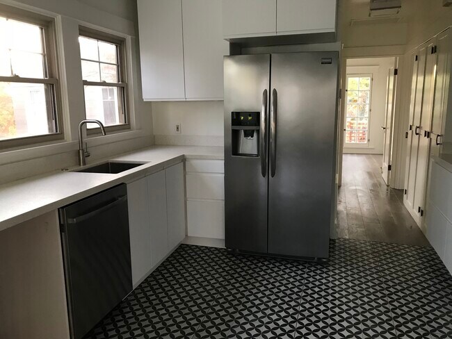 Kitchen. Whole bank of cabinets and counter space on other side. - 1015 Manzanita St