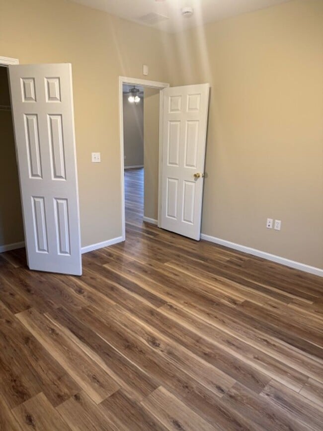 Photo - 3 Bedroom 2 full bath home with oversized 2 car garage new vinyl flooring and community pool access