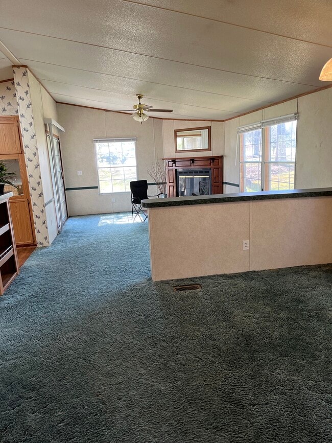 Dining area and den with fireplace - 2301 Wildcat Creek Rd