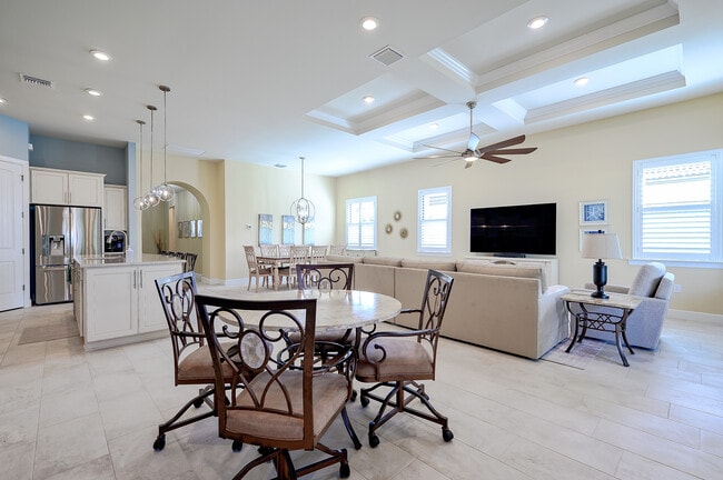 “Bright, open-concept living space with comfortable furnishings and natural light and 75" Smart TV” - 14032 Hawks Eye Ct