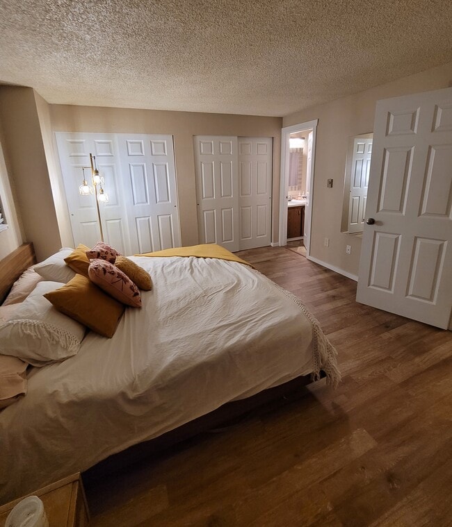 Primary bedroom with entrance to bathroom - 15707 4th Ave S Unit 23