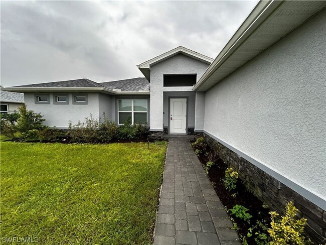 Building Photo - Available mid July! 4 Bed 2 Bath in NW Cape Coral!