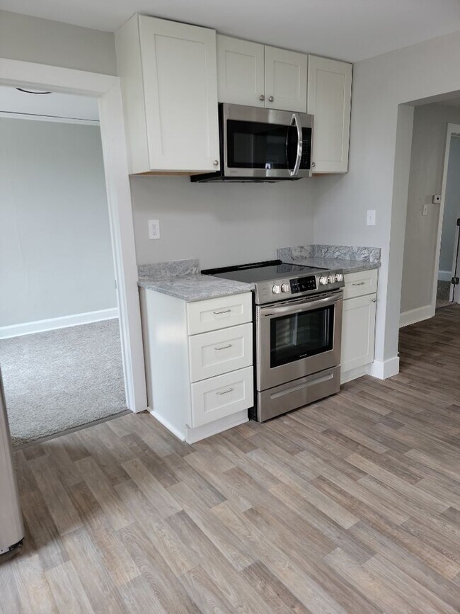 Photo - AVAILABLE JUNE 1st 2026 - Fantastic Newly Renovated 5 Bed 2 Bath Home w/ Garage