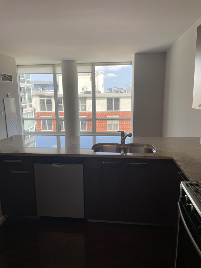 Open concept kitchen living space - 954 W Monroe St Apartments Unit 208