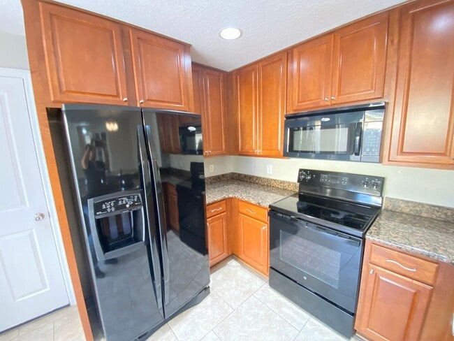 Photo - Avalon Park corner end Townhome featuring 3 bedrooms, 2.5 baths, plus office, and 2 car garage.