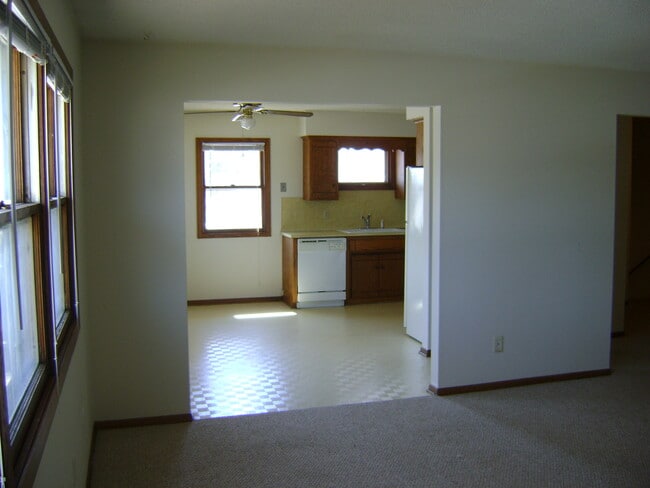 Living room looking into kitchen and dining room area - 2233 5th Ave, NE Unit 2, Upstairs