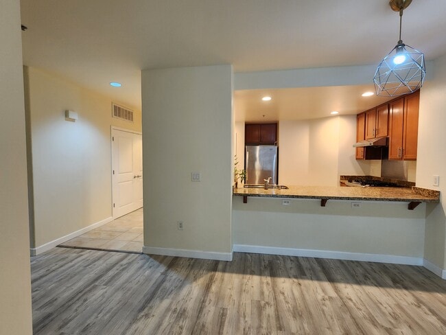 View of Kitchen from Dining/Living Room - 423 7th St Unit 203