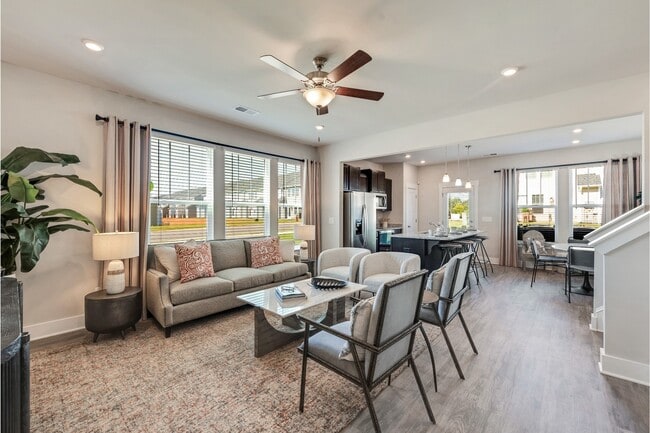 Living Room with Vinyl Plank Flooring and Lots of Windows for Natural Light