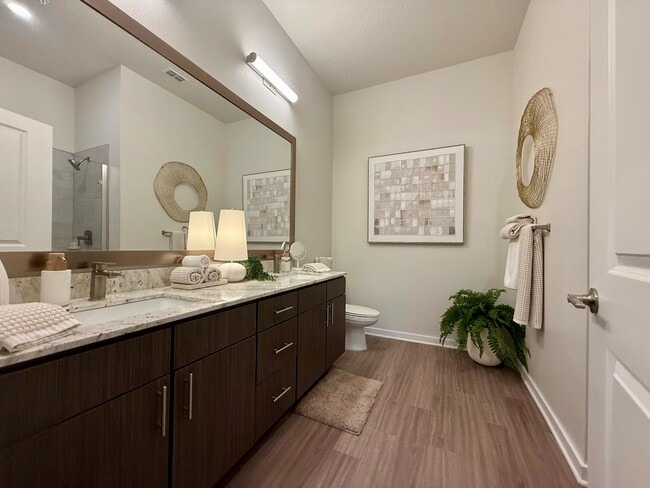 Integra Palms: Experience the tranquility of this beautifully designed bathroom, perfect for relaxation and style. - Integra Palms Apartments
