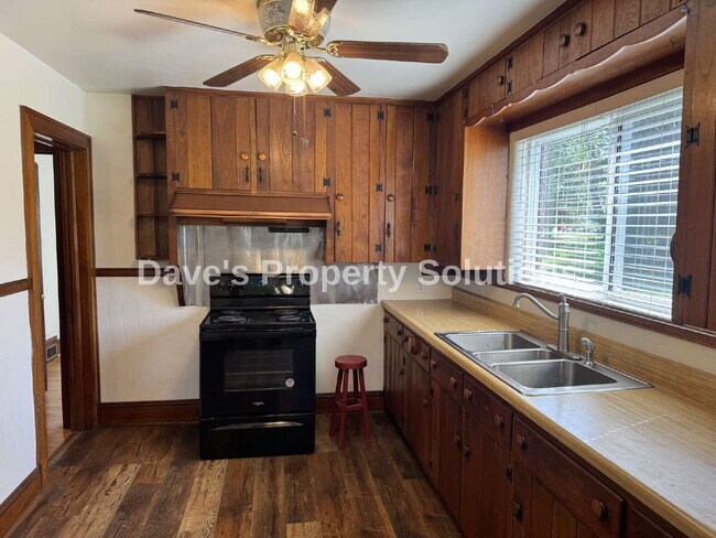 Photo - Spacious Living on ~1 Acre! | 3-Car Garage + Extra Covered Parking | Landscaping Included!