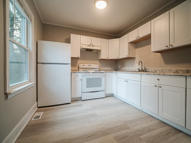 Photo - "Charming 4-Bedroom Gem in Charlotte - Cozy Living with Spacious Comfort!"