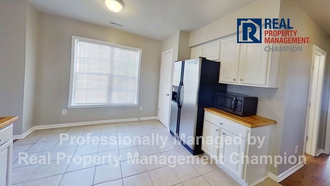 Photo - Charming home with open floor plan, vaulted ceilings and spacious backyard