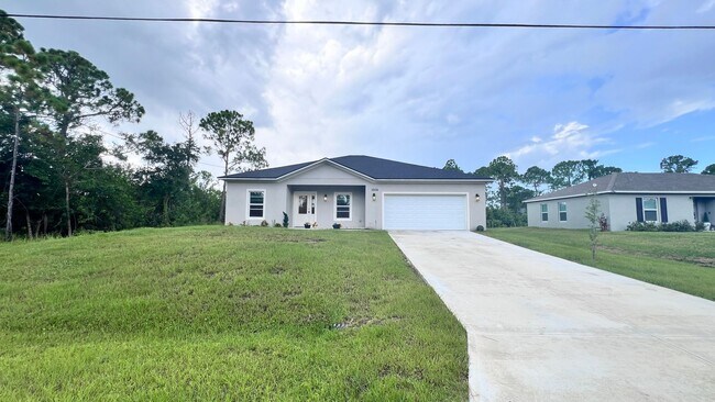 Building Photo - WONDERFUL 4 BD/2BA Home in Beautiful Palm ...