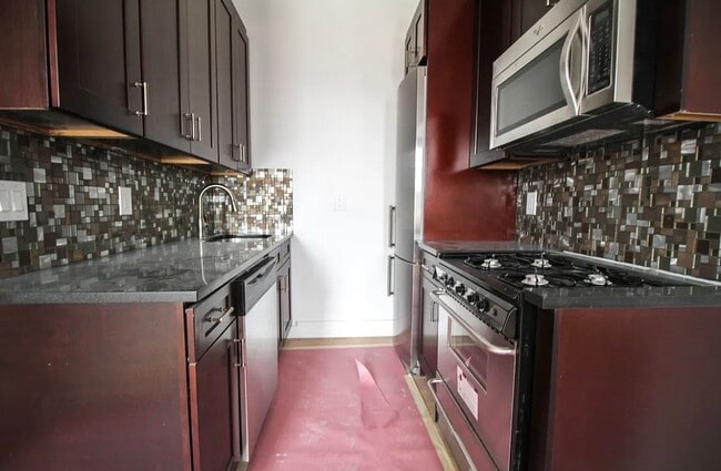 Building Photo - 6702 60th St Unit 1