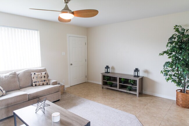 Shared Living room and kitchen space - 7561 E Belleview St Unit Belleview House