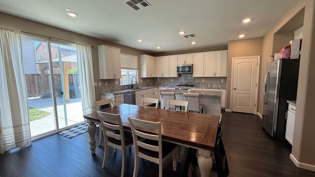 Photo - Spacious 5-Bedroom Home | Private Yard + Attached Garage