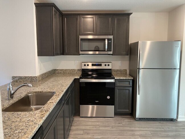 Photo - Like New 3/2/2 house with a screened in porch.