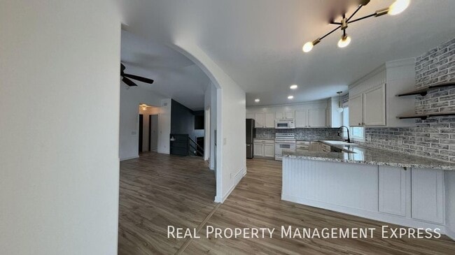 Photo - Spacious 4BR, 2BA Gem with Fireplace and Open Basement