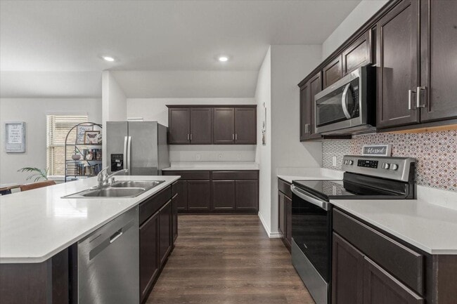 Photo - Modern single-story home with 4 bedrooms, 2 bathrooms, open-concept living, stylish kitchen, two-...