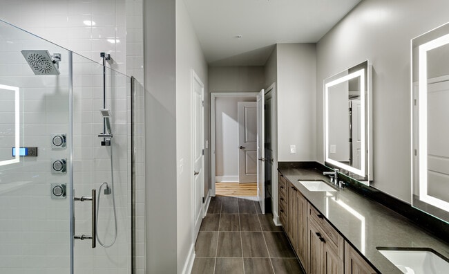 Penthouse-level Signature Collection apartment homes feature baths with upgraded finishes