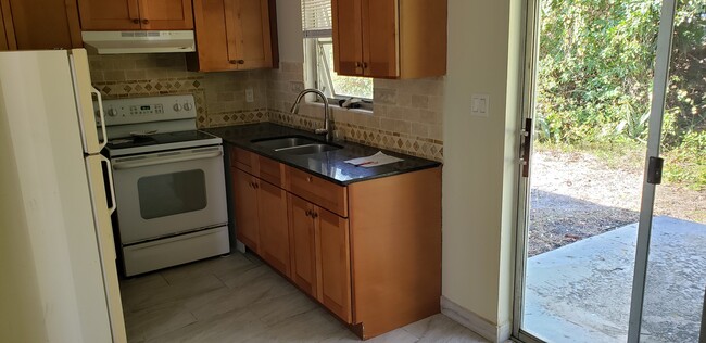 Kitchen has patio doors - 27677 Okeana St Apartments Unit 6