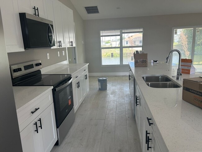 Photo - Coming soon 4/3 new construction overlooking canal