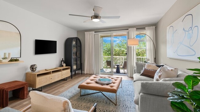 Bright living spaces feature private balconies, large windows, and contemporary finishes