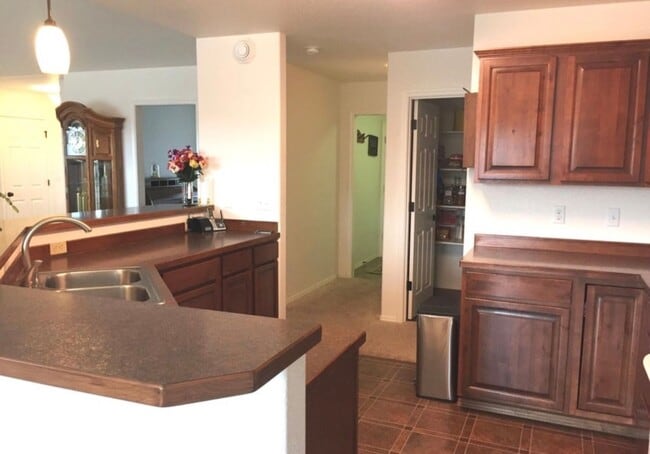 Photo - Ranch style 3 bedrooms with an office Plus a 3 car garage and large back yard complete with green...