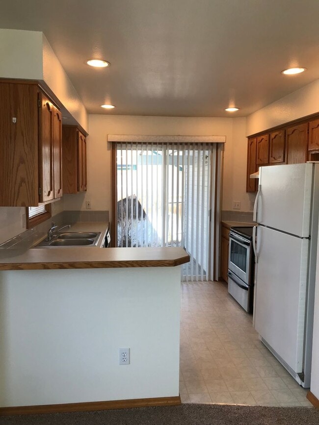 Photo - Adorable Well-Cared-For Duplex w/ Garage & Manicured Backyard!