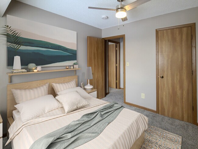 Renovated Three-Bedroom Apartment Bedroom at Prairie West in Ames, IA - Prairie West