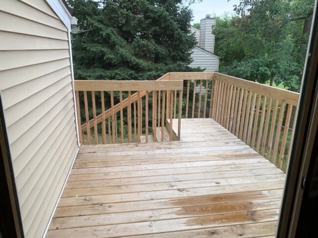 Photo - 2 BR, 1.5 BA Clive split level duplex. Deck and one car attached garage.