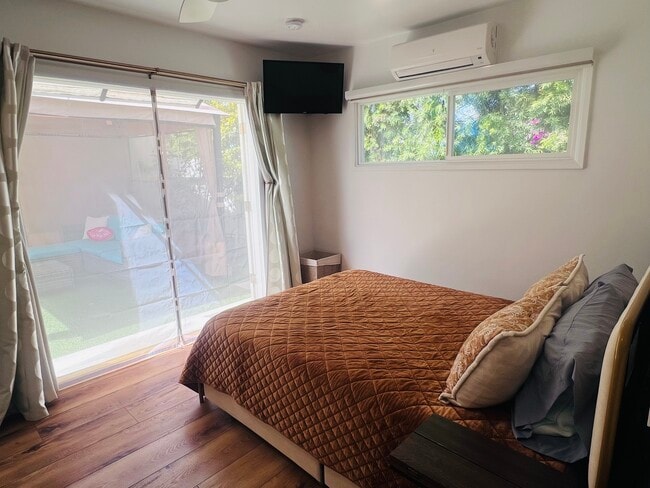 French door open to blossoming outdoor living space. - 2150 Euclid Ave Unit A