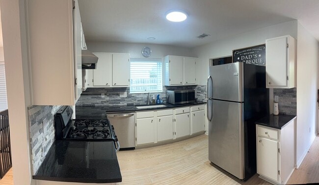Photo - Beautiful 4-Bedroom Spring Home with Updated Primary Bath & Covered Patio