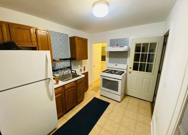 Walk through kitchen - 1164 Cook Ave E