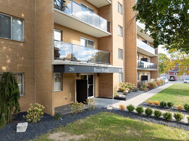 MANICURED ENTRANCE - Brant Manor Apartments