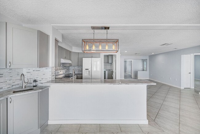 Photo - 3/2 Just Steps to the Intercoastal with Boat Ramp and Dock