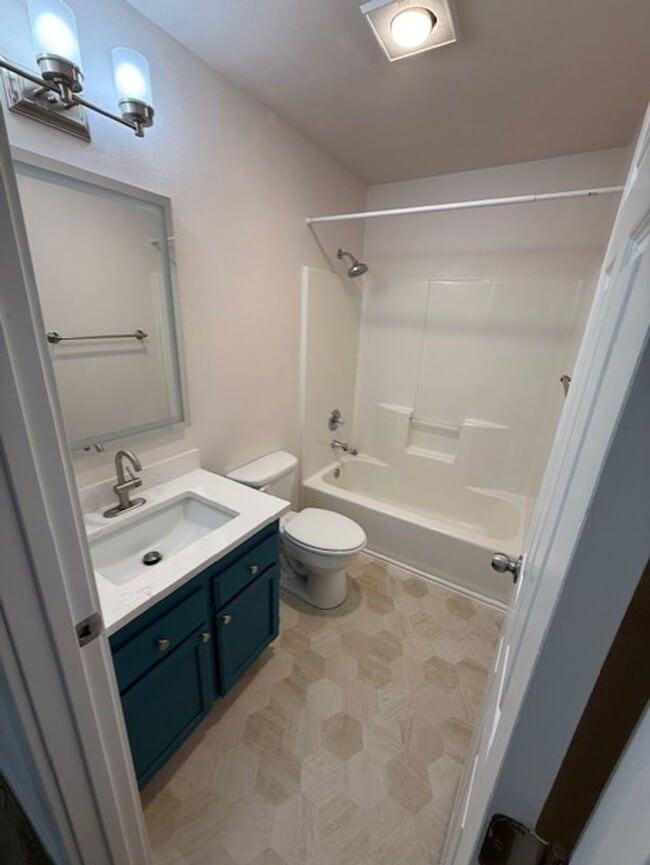 Photo - Updated duplex on quiet street. Large yard, all appliances.