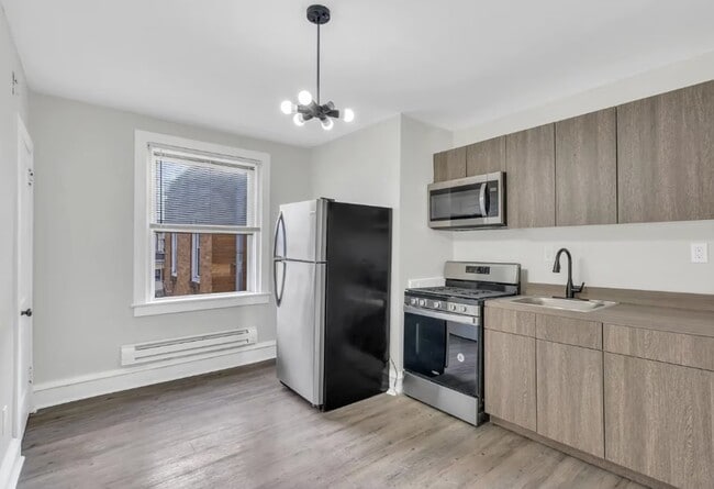 Building Photo - 6702 Oakley St Unit 6706 Oakley St. Apt A