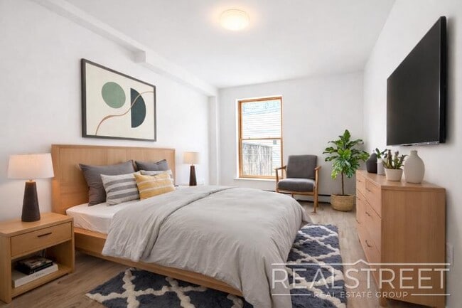 Photo - Full-Floor Renovated 2BR | Expansive Living Space | 1 Min to A Train Unit 3