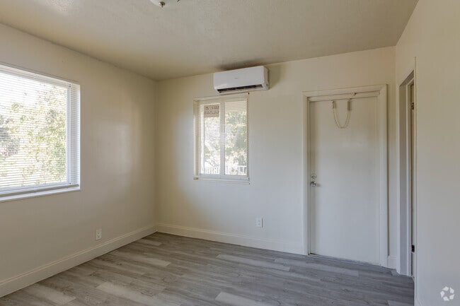 Bedroom with Windows - Riverland Court Apartments